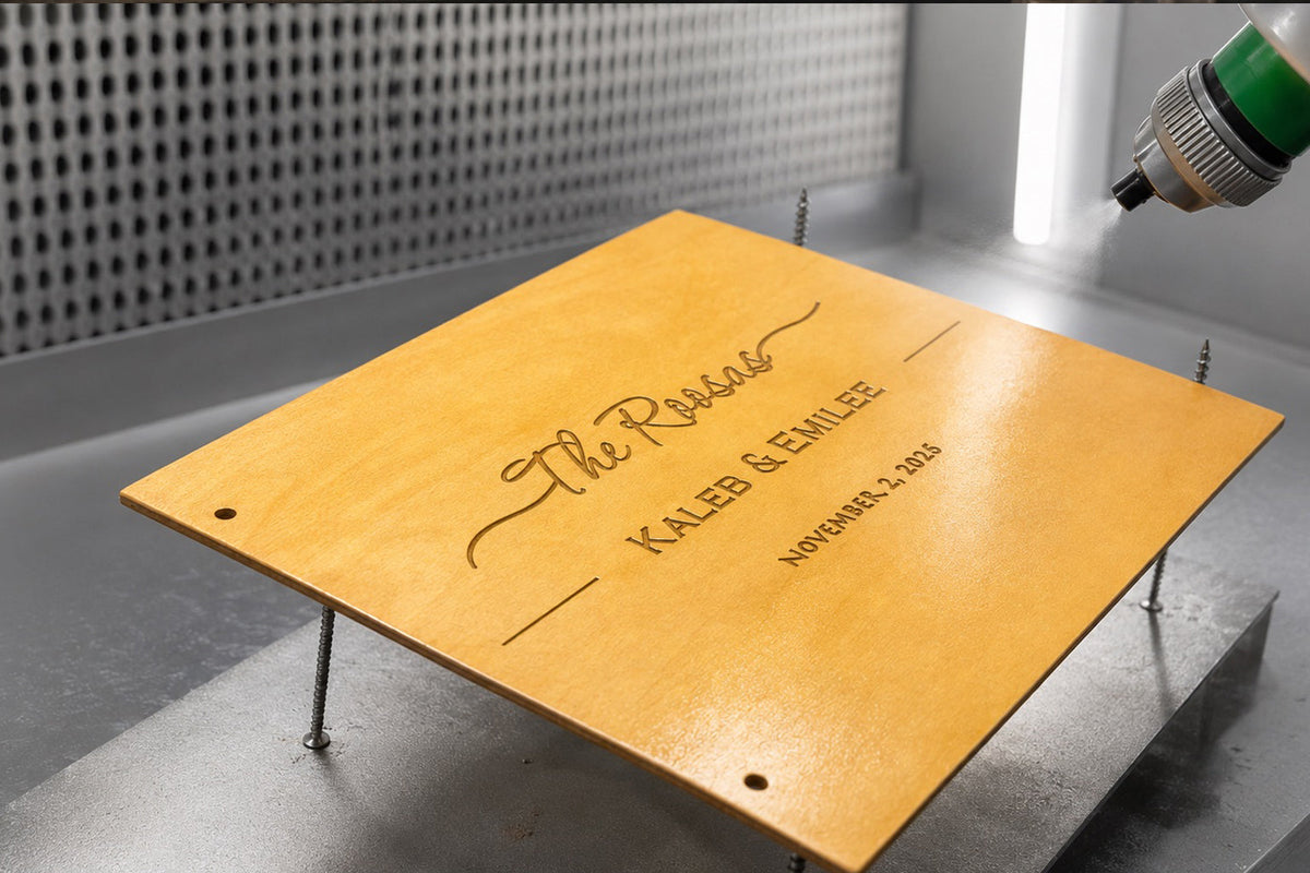 Personalized wooden wedding guest book with engraved family name being finished by hand in our workshop