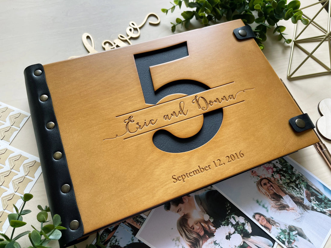 fifth anniversary photo album with cut out number 5 and black first page