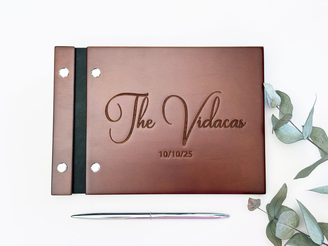 Custom engraved family name on walnut wedding guest book cover