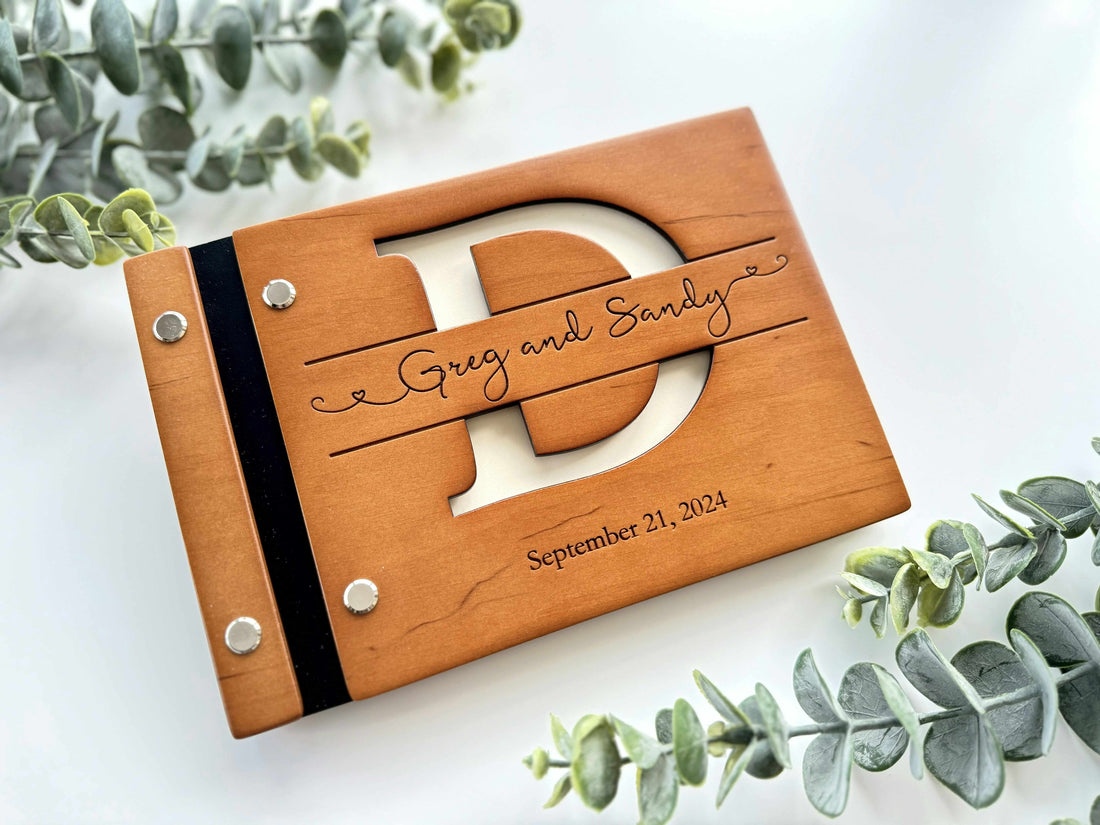 Monogram wooden wedding guest book with personalized initial cutout
