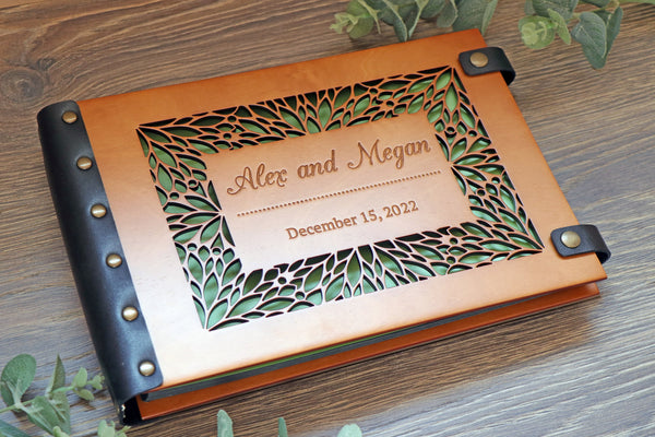 Personalized wooden wedding album with laser-cut floral frame