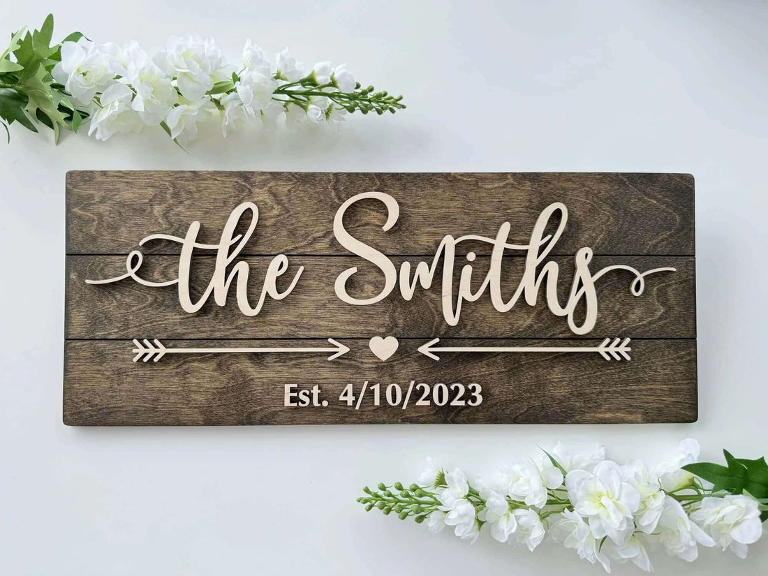 Personalized wooden family name sign with natural raised letters, arrows and heart, Est