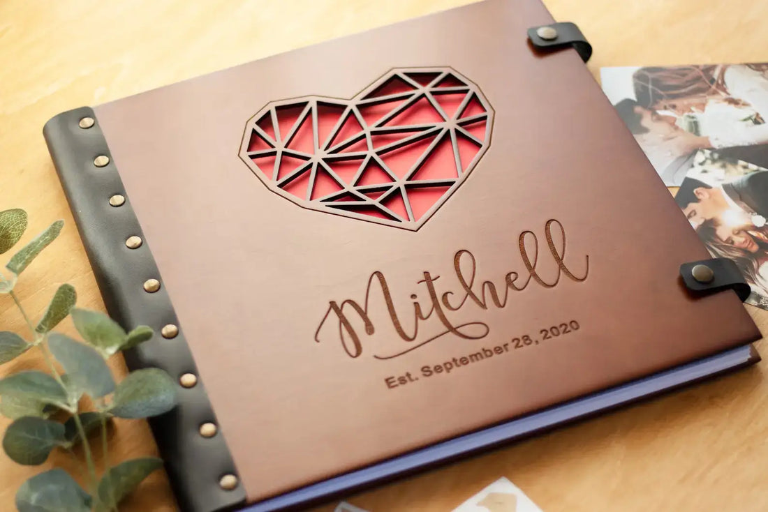 Open wooden photo album showing thick pages for scrapbooking and durable leather binding with rivets