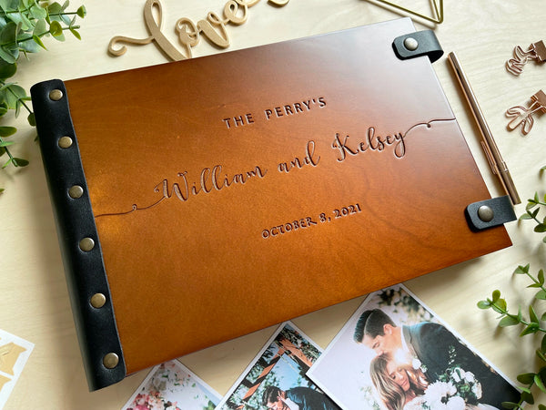 minimalist wedding photo album engraved with last name and couple names