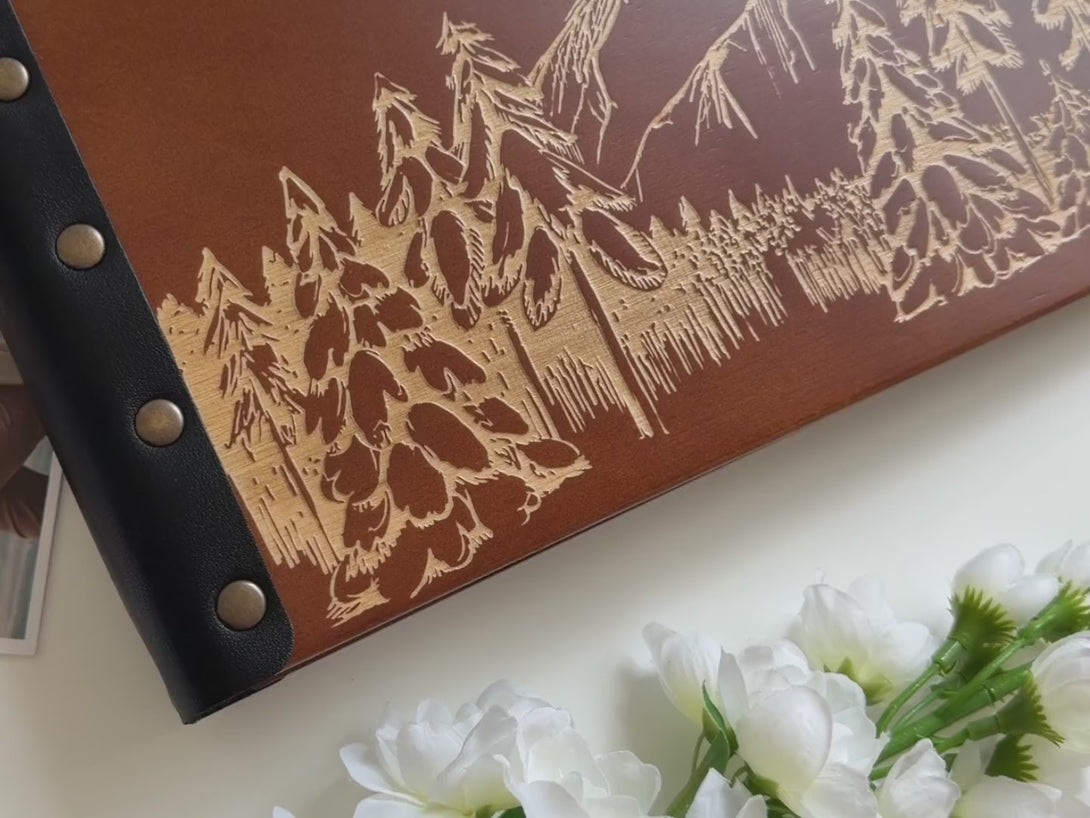 mountain travel scrapbook album with engagement photos