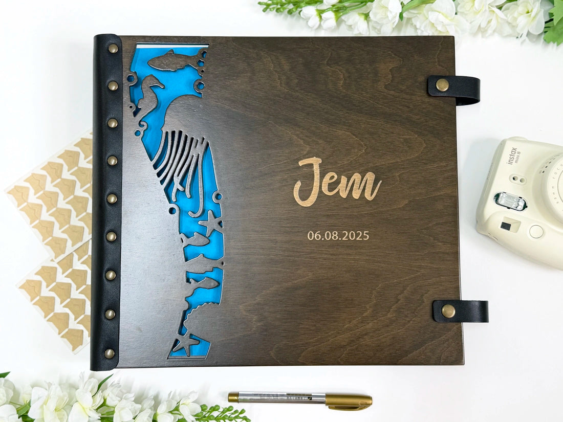 Under the sea baby photo album with laser-cut fish and blue first page